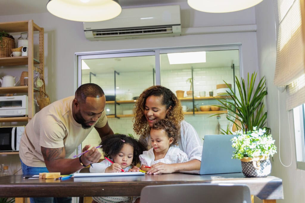 Wortham Air Conditioning - Family Together Indoors Enjoying AC