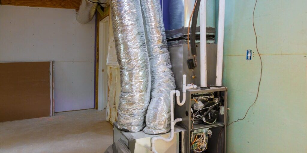 Wortham AC - Basement Interior with HVAC and Ductwork Installation