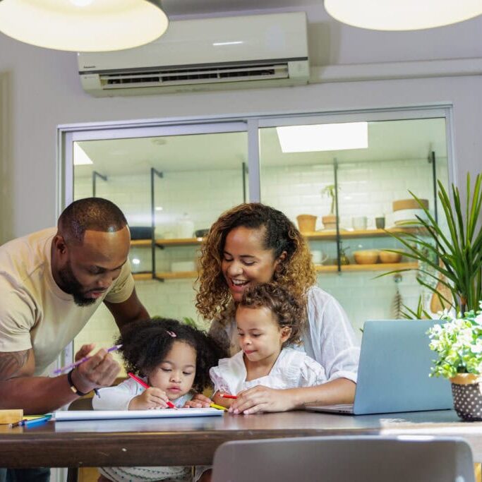 Wortham Air Conditioning - Family Together Indoors Enjoying AC