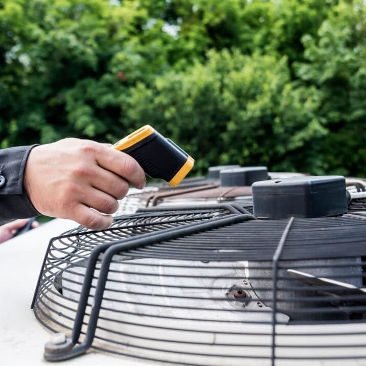 Wortham Air Conditioning - HVAC Technician Inspecting AC