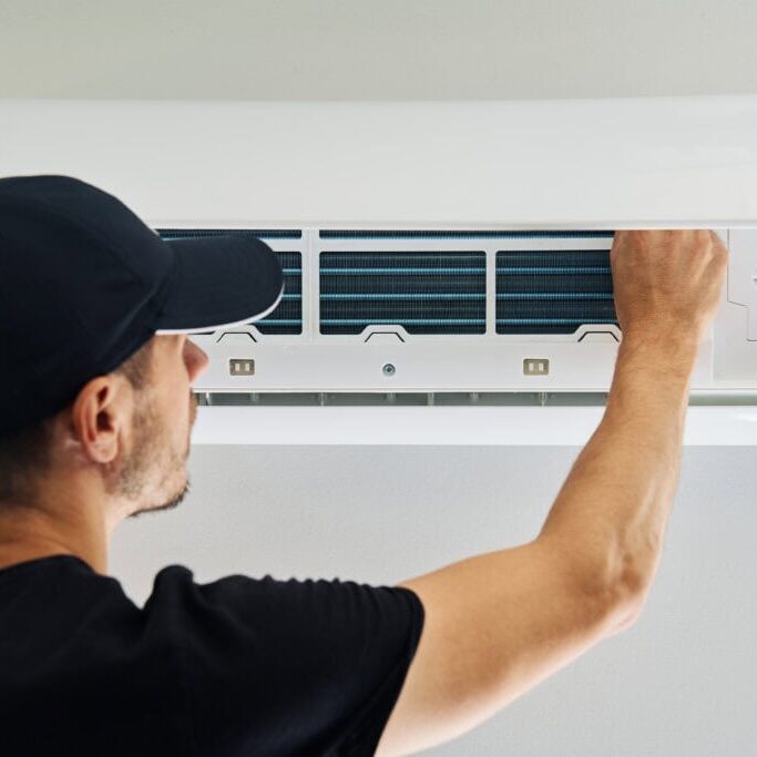 Wortham Air Conditioning - Man Repairing AC Indoor Unit