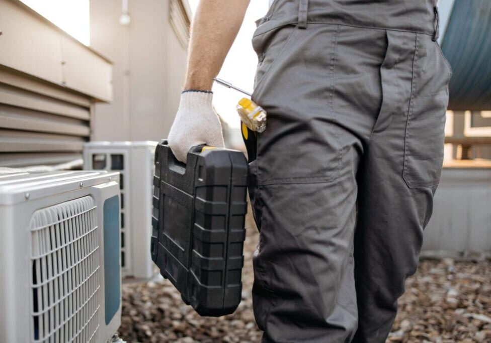 Wortham Air Conditioning - Repairman Working on AC